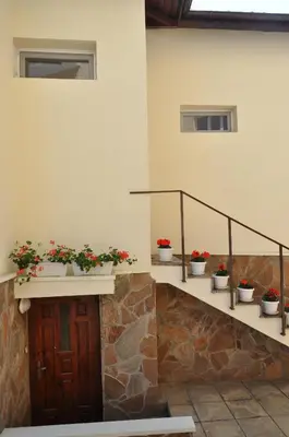 a set of stairs with potted plants on them at Къща за гости Ирис in Kyustendil