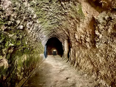 a tunnel in a mountain with a car in it at Hotel Slavova Krepost in Melnik