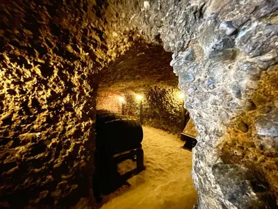 a tunnel in a cave with a chair in it at Hotel Slavova Krepost in Melnik
