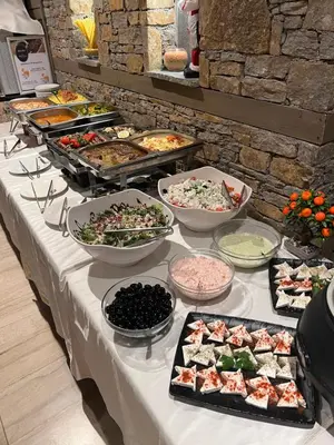 a buffet with many different types of food on a table at Hotel Panorama Velingrad in Velingrad