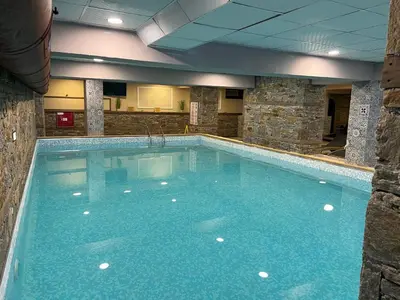 a large swimming pool in a hotel room at Hotel Panorama Velingrad in Velingrad