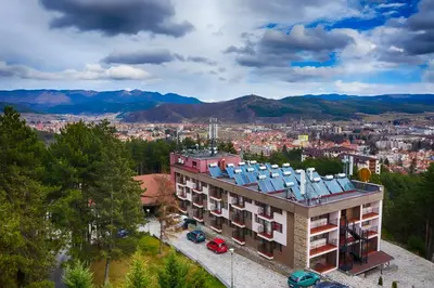 an aerial view of a building with a city at Hotel Panorama Velingrad in Velingrad