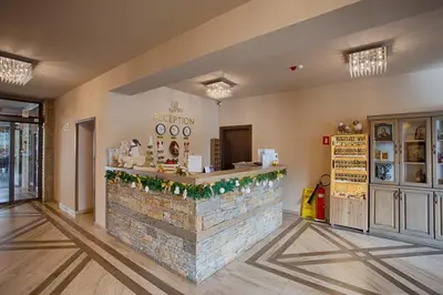a restaurant with a stone counter in a room at Hotel Panorama Velingrad in Velingrad