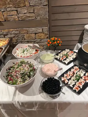 a table with many different types of food on it at Hotel Panorama Velingrad in Velingrad