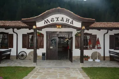 a building with a sign that reads mexican at хотел Чифлика - комплекс Чифлика in Chiflik
