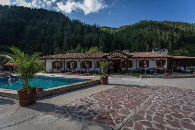 a resort with a swimming pool in front of a building at хотел Чифлика - комплекс Чифлика in Chiflik