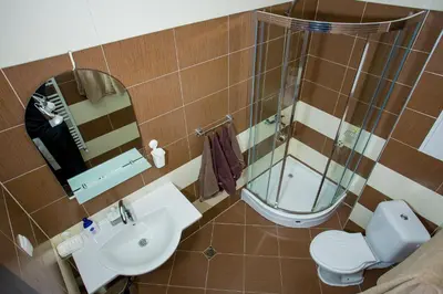a bathroom with a sink and a toilet and a mirror at Apartment IVA - Iglika 2 in Borovets
