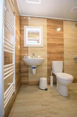 a bathroom with a toilet and a sink at Апартаменти Принц и Принцеса in Sandanski