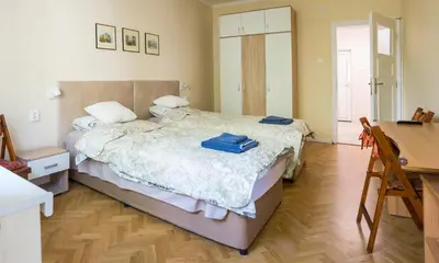 a bedroom with a bed and a desk and a desk at Bright and Cozy 2BD Flat in Plovdiv City Centre by Flat Mаnager in Plovdiv