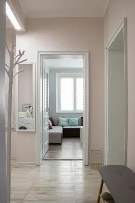 a living room with a couch and a window at Bright and Cozy 2BD Flat in Plovdiv City Centre by Flat Mаnager in Plovdiv