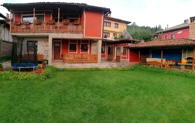 a house with a large yard in front of it at Радкината къща in Koprivshtitsa