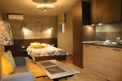 a small kitchen with a bed in a room at Urban House in Sofia