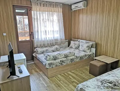 a small room with a bed and a couch at Bali Petrich in Petrich