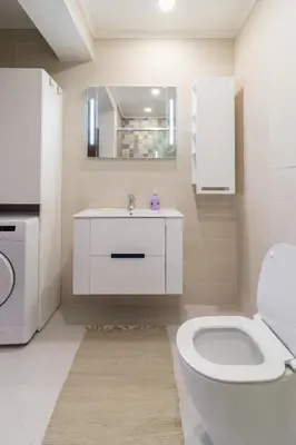 a white bathroom with a sink and a toilet at Pop your COLORS - Funky and Modern 1BDR Apt by Flat Mаnager in Plovdiv