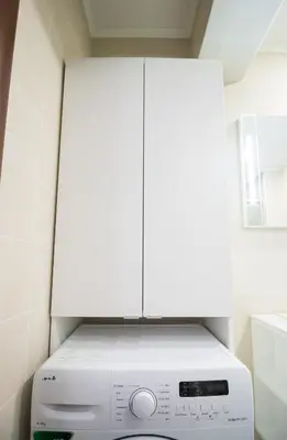 a washer and dryer in a kitchen with white cabinets at Pop your COLORS - Funky and Modern 1BDR Apt by Flat Mаnager in Plovdiv