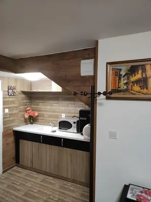 a kitchen with a sink and a microwave at Marchevi in the Old Town in Plovdiv