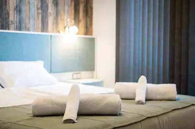 a hotel room with two towels on a bed at Sofia Artist Life Apartment in Sofia