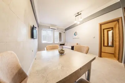 a dining room with a table and chairs at Sofia Industrial Life Apartment in Sofia