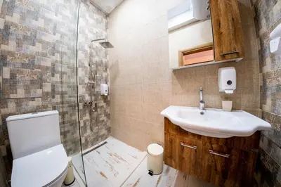 a bathroom with a sink and a shower at Sofia Industrial Life Apartment in Sofia