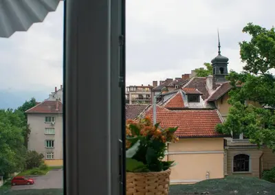 a view of a city from a window at Cozy apartment in the historical center of Sofia in Sofia
