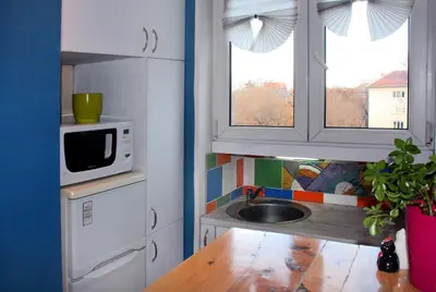 a small kitchen with a sink and a microwave at Cozy apartment in the historical center of Sofia in Sofia