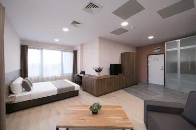 a bedroom with a bed and a living room at B1 Boutique Hotel Sofia in Sofia