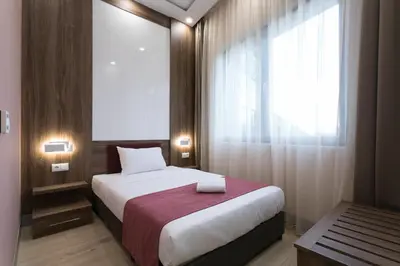 a bedroom with a large bed and a window at B1 Boutique Hotel Sofia in Sofia