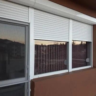 a window with blinds on a house at Apartment Petya in Velingrad