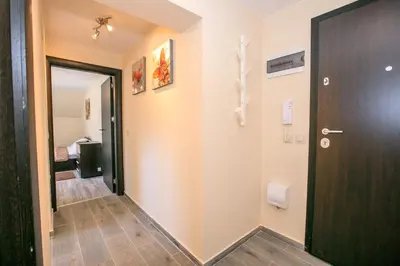 a hallway with a door and a room at Sunpark Apartment in Sandanski