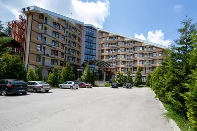 a parking lot in front of a large building at Deluxe 217 in Borovets