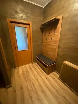 a small room with a door and a bench in it at Deluxe 217 in Borovets