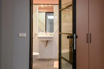 a bathroom with a toilet and a sink at ROSÉ one bedroom designer apartment in city centre by Flat Mаnager in Sofia