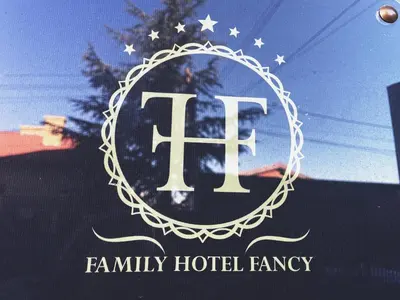 a sign for a family hotel agency with a flag at Hotel Fancy in Sofia