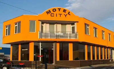 an orange building with the words mother city on it at МОТЕЛ СИТИ с БЕЗПЛАТЕН ПАРКИНГ in Plovdiv