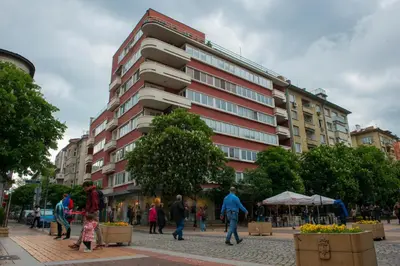 a group of people walking in front of a building at Design Apartment in Sofia top city center in Sofia