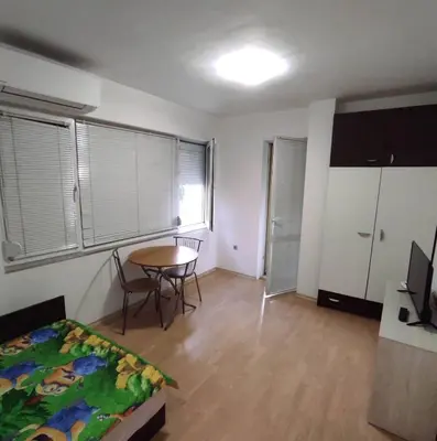 a bedroom with a table and a bed and a table at encanto in Plovdiv