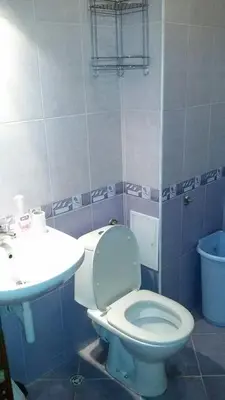a bathroom with a toilet and a sink at encanto in Plovdiv