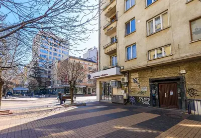 an empty street in a city with buildings at Zero-Waste Studio Apartment in Central Sofia in Sofia