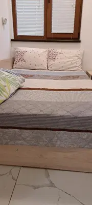 two beds sitting next to each other in a bedroom at lux in Plovdiv