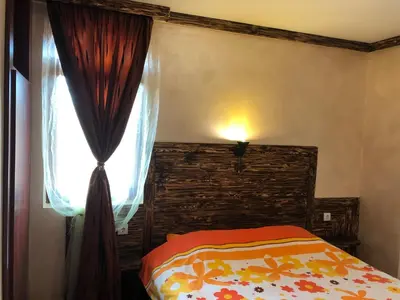 a bedroom with a bed and a window at Pamporovo Villa in Pamporovo