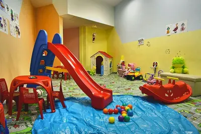 a childs play room with a slide and play equipment at VIVA Flora apartment 607A in Borovets