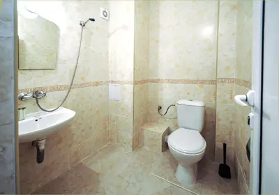 a bathroom with a toilet and a sink at Best Rest Guest Rooms in Plovdiv
