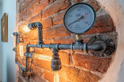 a clock is attached to a brick wall at Sophisticated Gem with Private parking in Sofia