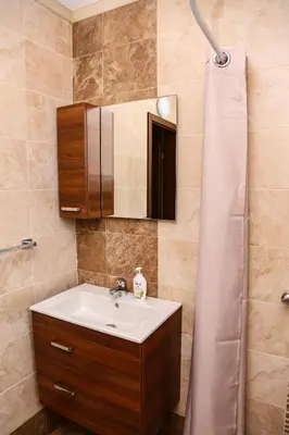 a bathroom with a sink and a mirror at Villa Kashtata in Resilovo
