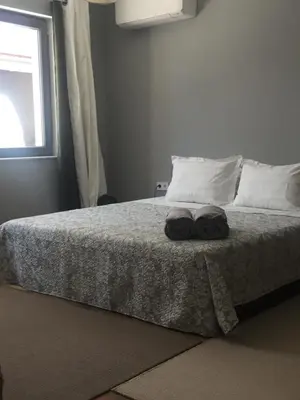 a bedroom with a bed with two towels on it at Casa Lavenda in Plovdiv