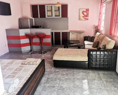a living room with a bed and a couch at Merilyn Petrich in Petrich