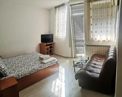 a living room with a bed and a couch at Merilyn Petrich in Petrich