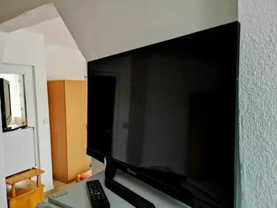 a flat screen tv hanging on a wall at Merilyn Petrich in Petrich