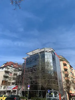 a glass building being constructed in a city at Lilia 4 Self-Check in apartment in Sofia