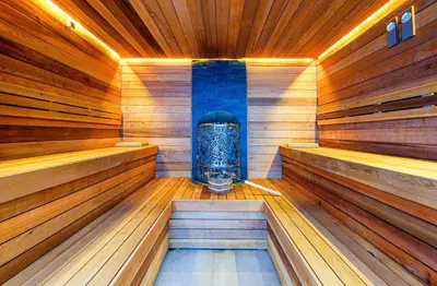 a sauna with a jacuzziificialificialificialificialificialificialificial at Predela LUX Aparthotel in Bansko